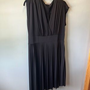 Black sleeveless dress. Never worn. Fitted bodice size 14